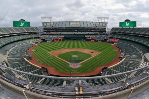 Grounds crew hands out dirt to fans as Oakland Coliseum hosts final A’s game