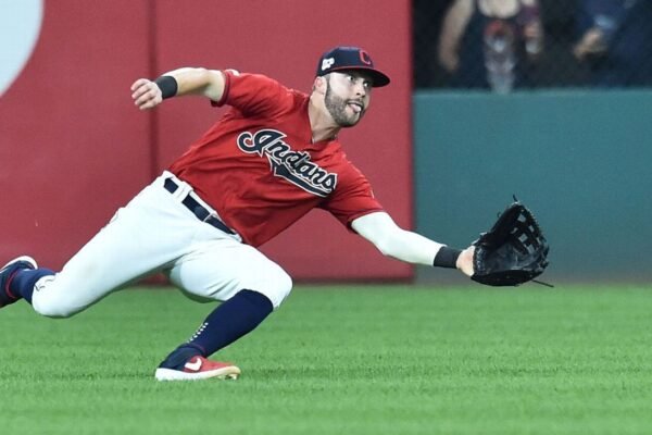 Ex-outfielder Naquin joins Guardians as pitcher