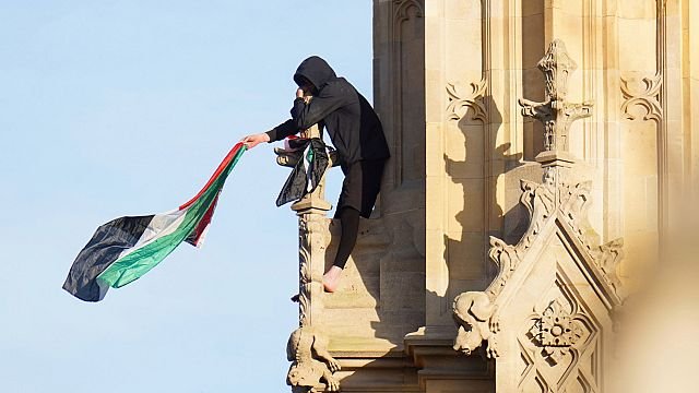 Man descends Big Ben tower after climbing with Palestinian flag